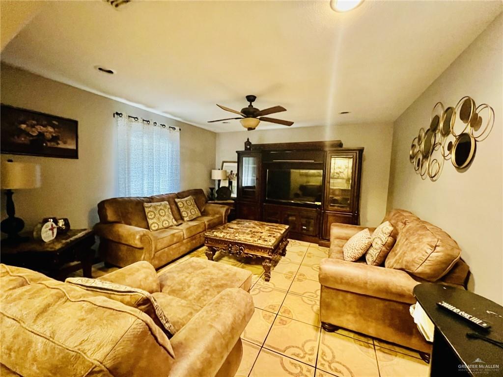 5 Montalvo Hill Road Rio Grande City, TX 78582 - Photo 4 of 42 a living room with furniture and a fireplace