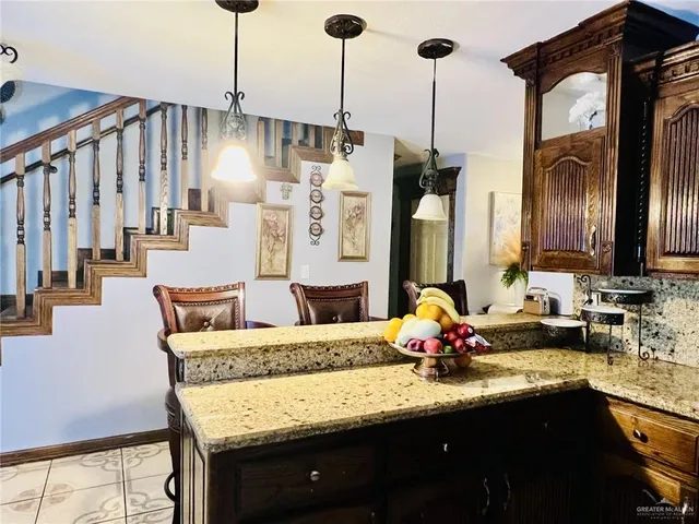 a bathroom with sinks and a mirror