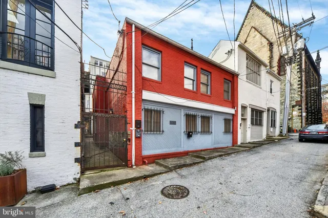 a view of a house with a street