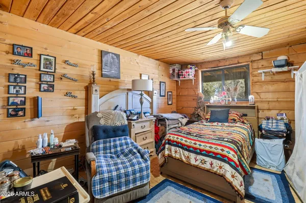 a bedroom with bed and a window