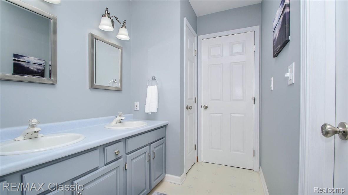 2322 Mooreville Road Milan, MI 48160 - Photo 30 of 78 Main floor full bath with double sinks