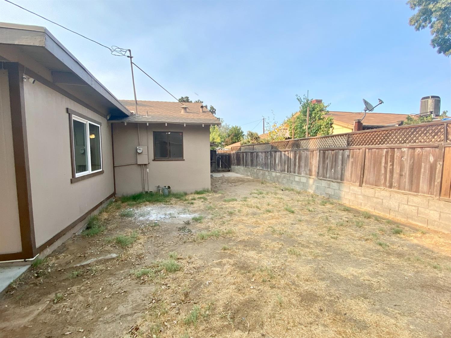 3310 East Hampton Way Fresno, CA 93726 - Photo 15 of 18 a view of a house with backyard and sitting area