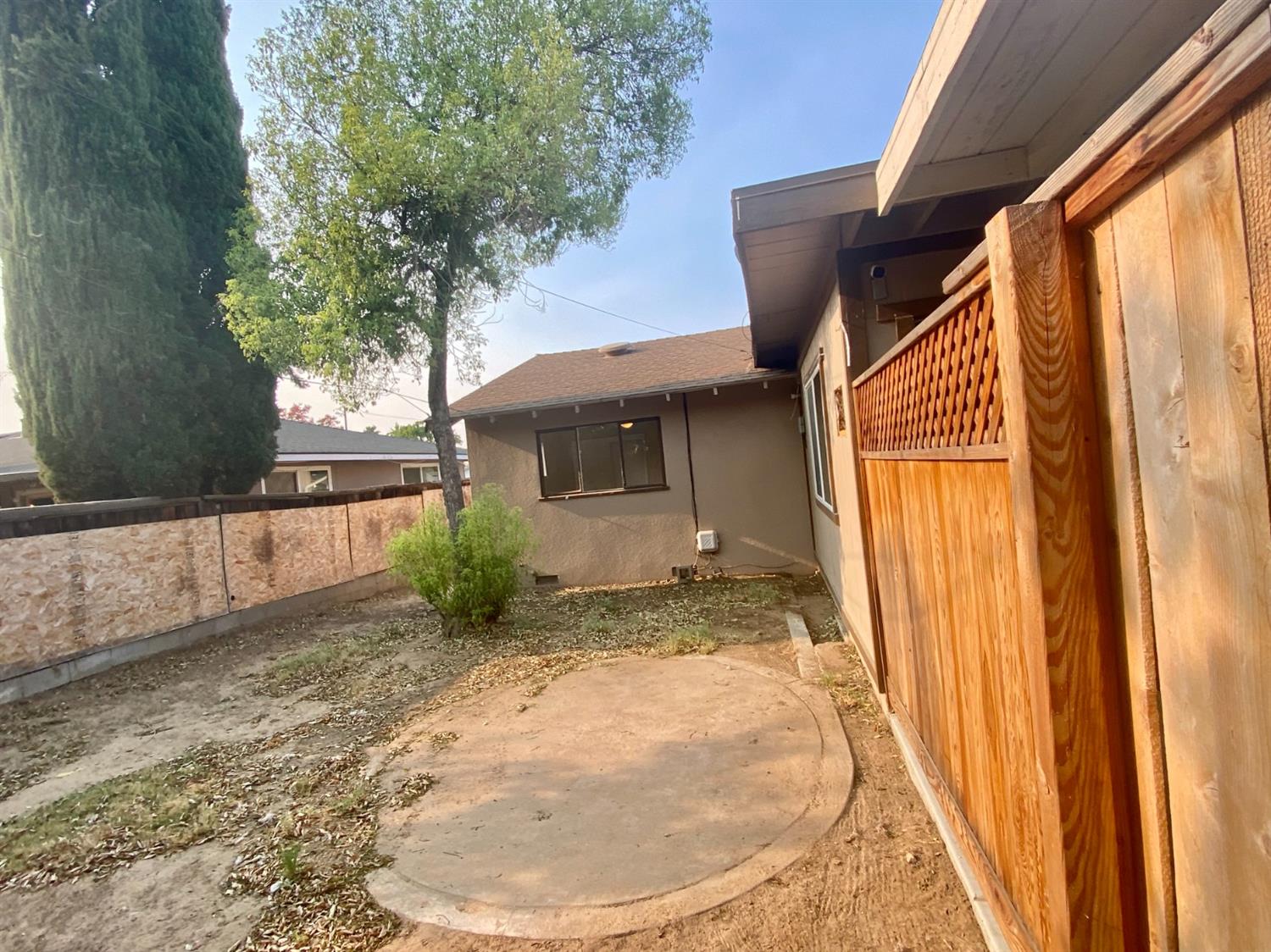 3310 East Hampton Way Fresno, CA 93726 - Photo 16 of 18 a view of a house with a sink and a yard