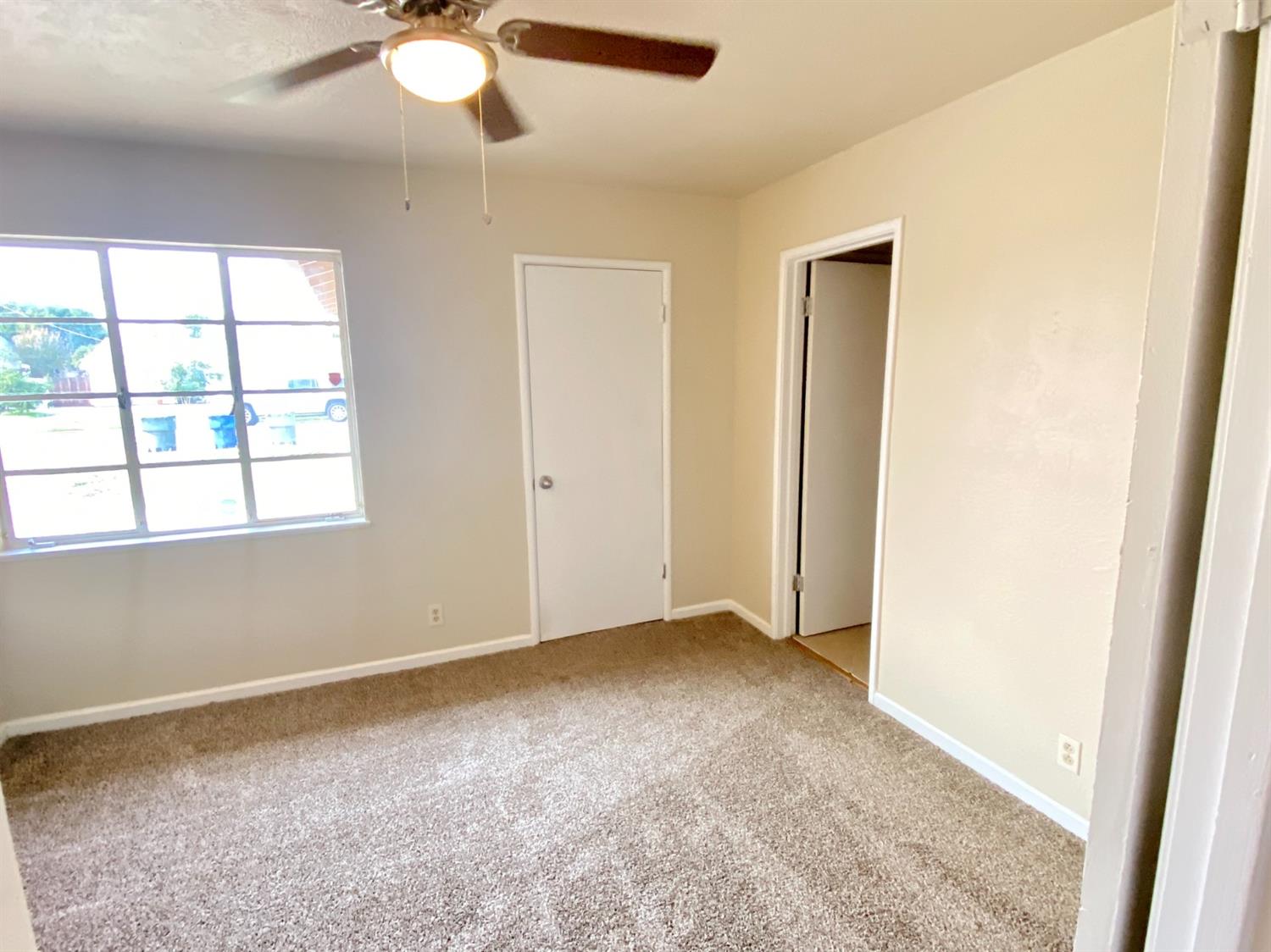 3310 East Hampton Way Fresno, CA 93726 - Photo 10 of 18 an empty room with a window