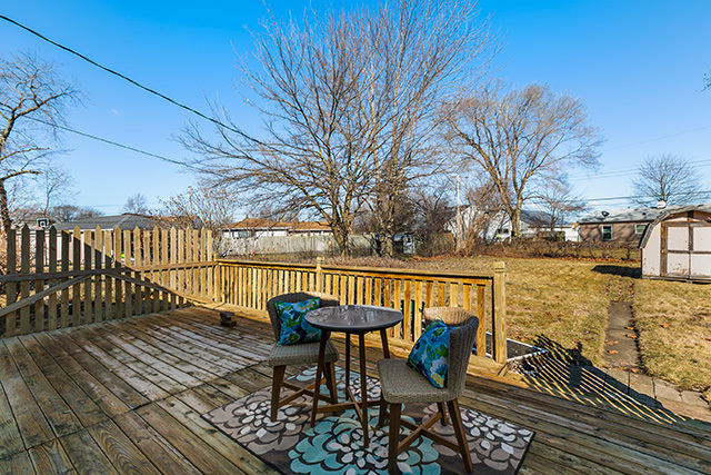 516 Amherst Avenue Romeoville, IL 60446 - Photo 14 of 15 a view of a chairs on the deck