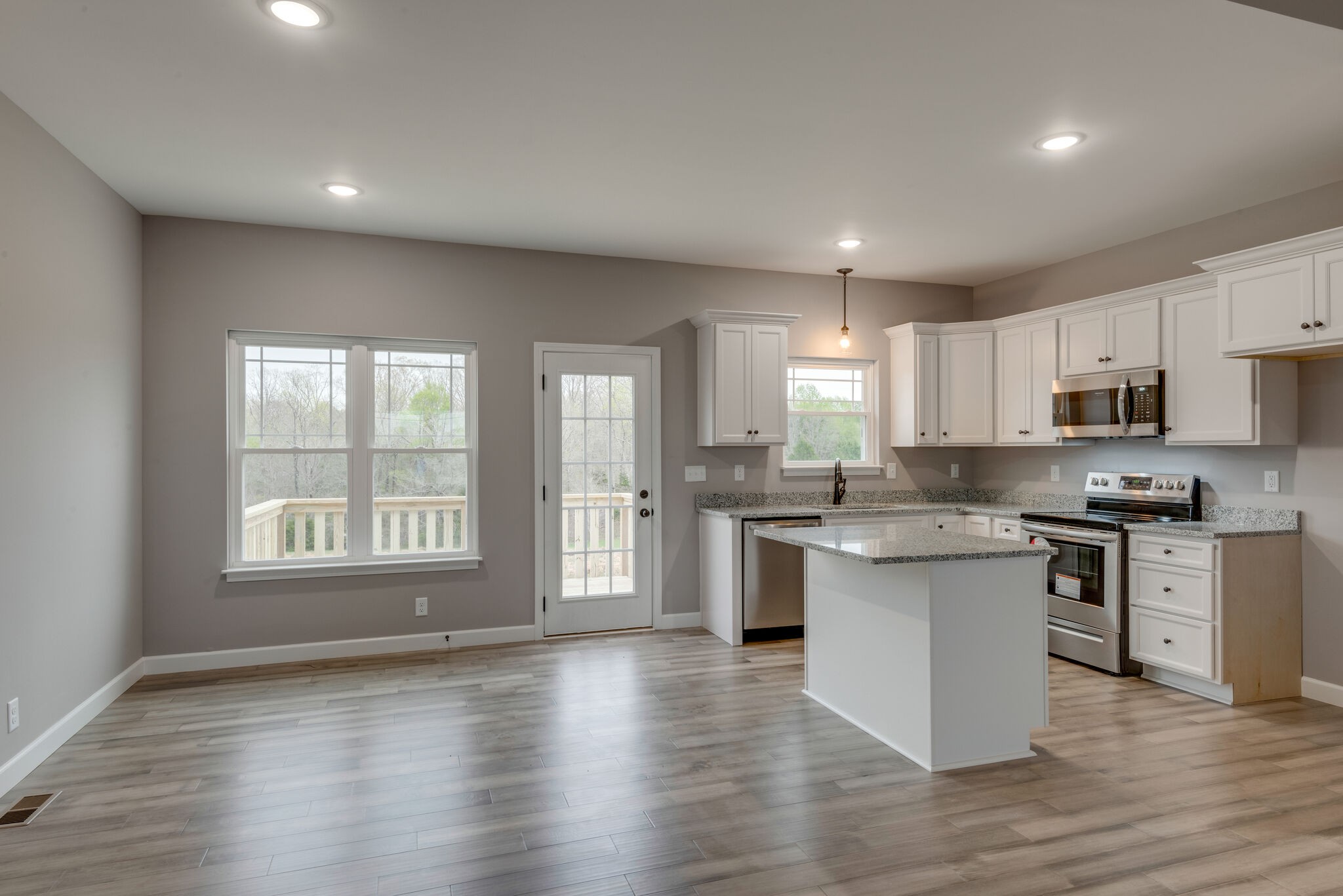 1271 Oak Grove Road Dickson, TN 37055 - Photo 8 of 18 a kitchen with a white stove top oven and white cabinets