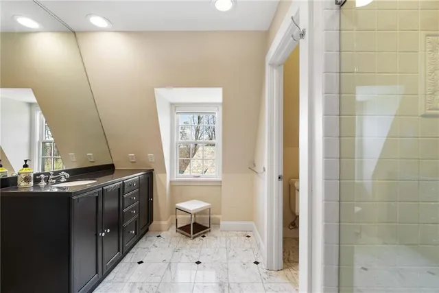 a kitchen with granite countertop a sink and stove