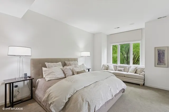 a bedroom with a bed and a couch