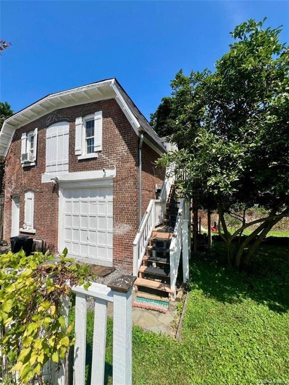 182 Grand Street Newburgh, NY 12550 - Photo 2 of 13 a front view of a house with a yard