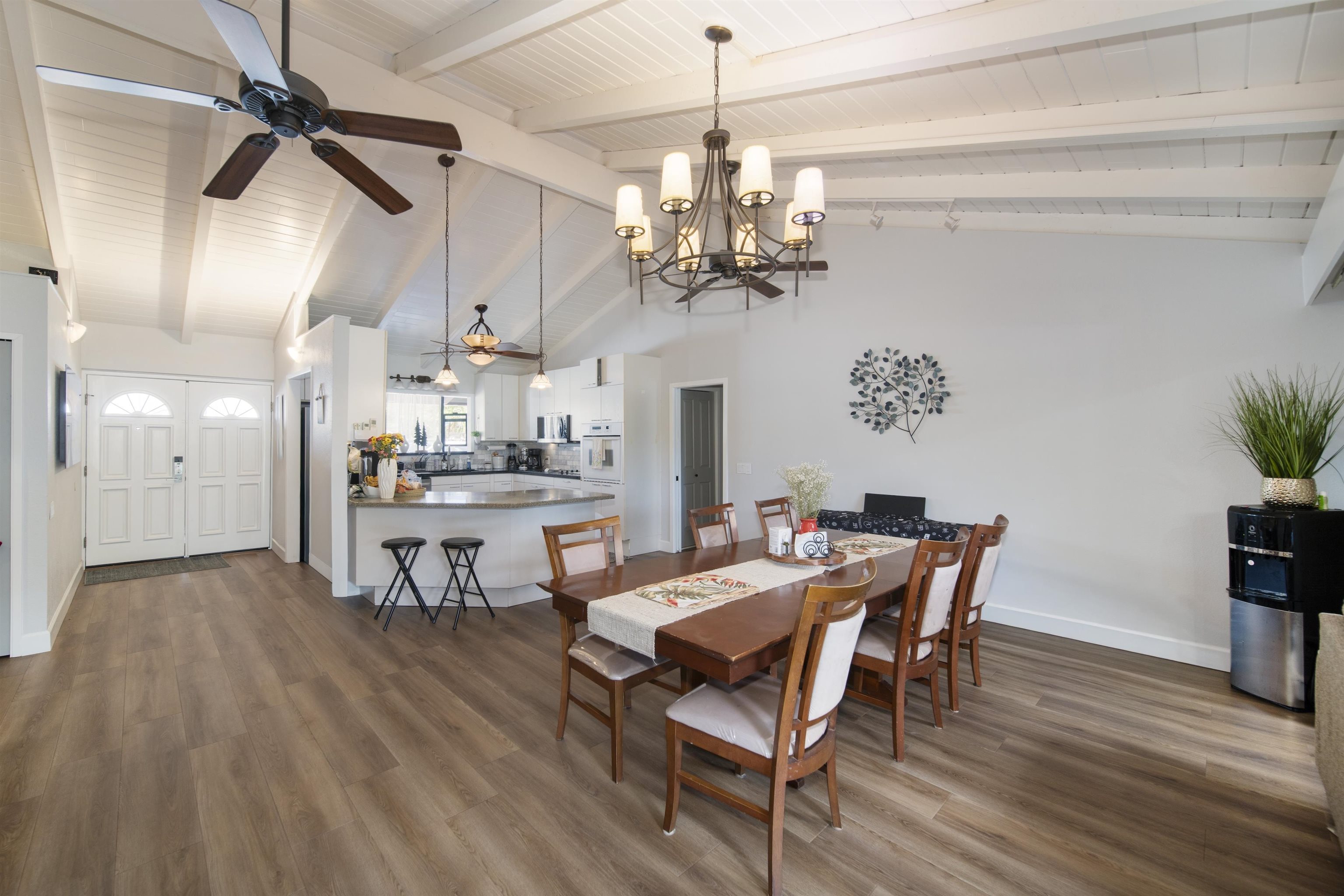 4996 Lower Honoapiilani Road Lahaina, HI 96761 - Photo 1 of 37 a view of a dining room with furniture and wooden floor