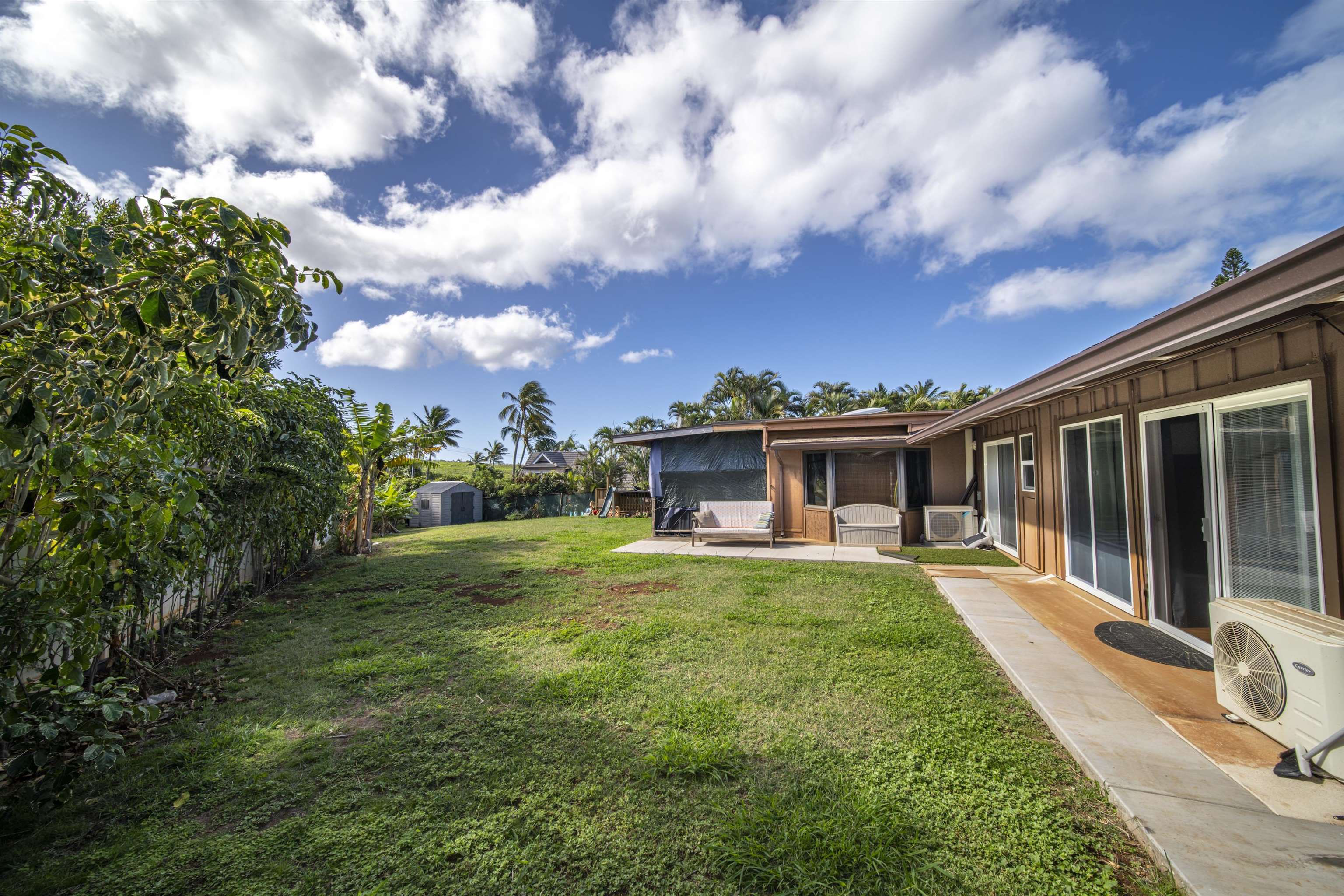 4996 Lower Honoapiilani Road Lahaina, HI 96761 - Photo 12 of 37 a front view of house with yard and trees