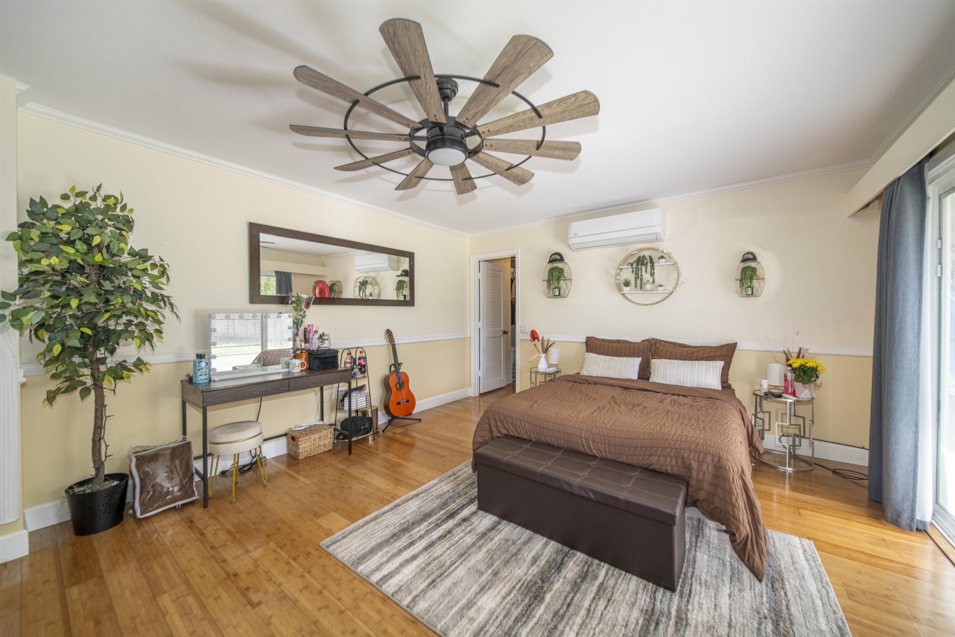 4996 Lower Honoapiilani Road Lahaina, HI 96761 - Photo 16 of 37 a bedroom with a bed and wooden floor