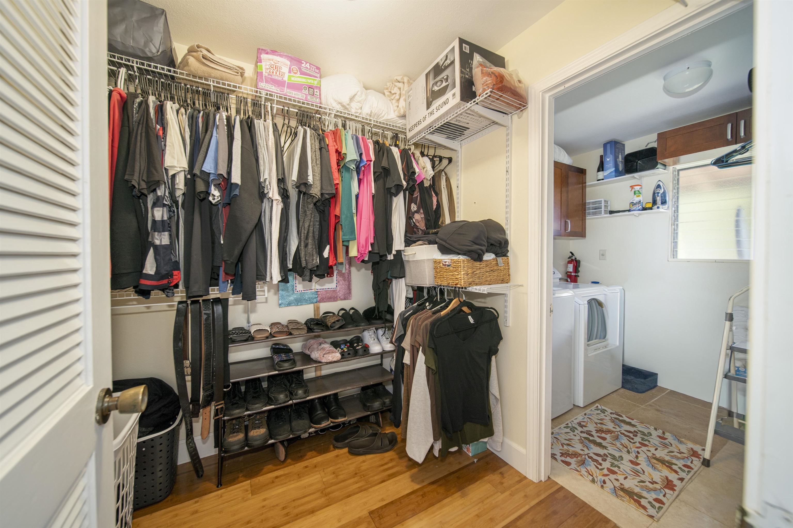 4996 Lower Honoapiilani Road Lahaina, HI 96761 - Photo 18 of 37 a view of walk in closet with clothes and shoes
