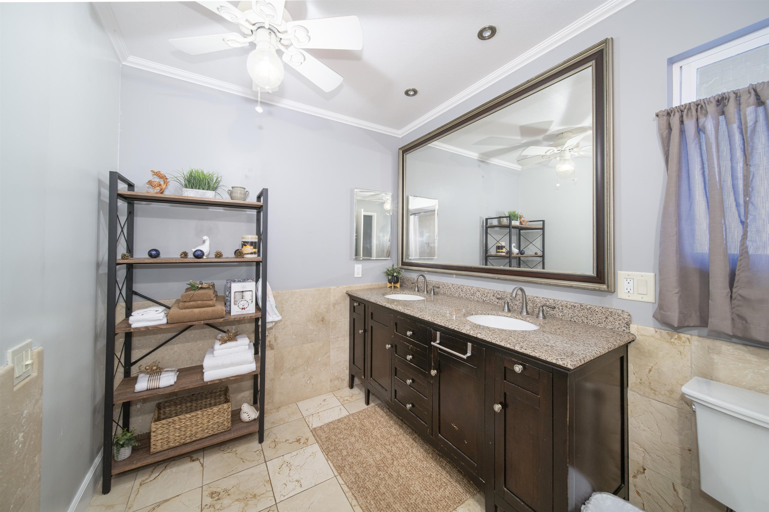 4996 Lower Honoapiilani Road Lahaina, HI 96761 - Photo 20 of 37 a bathroom with a sink a mirror and a shower