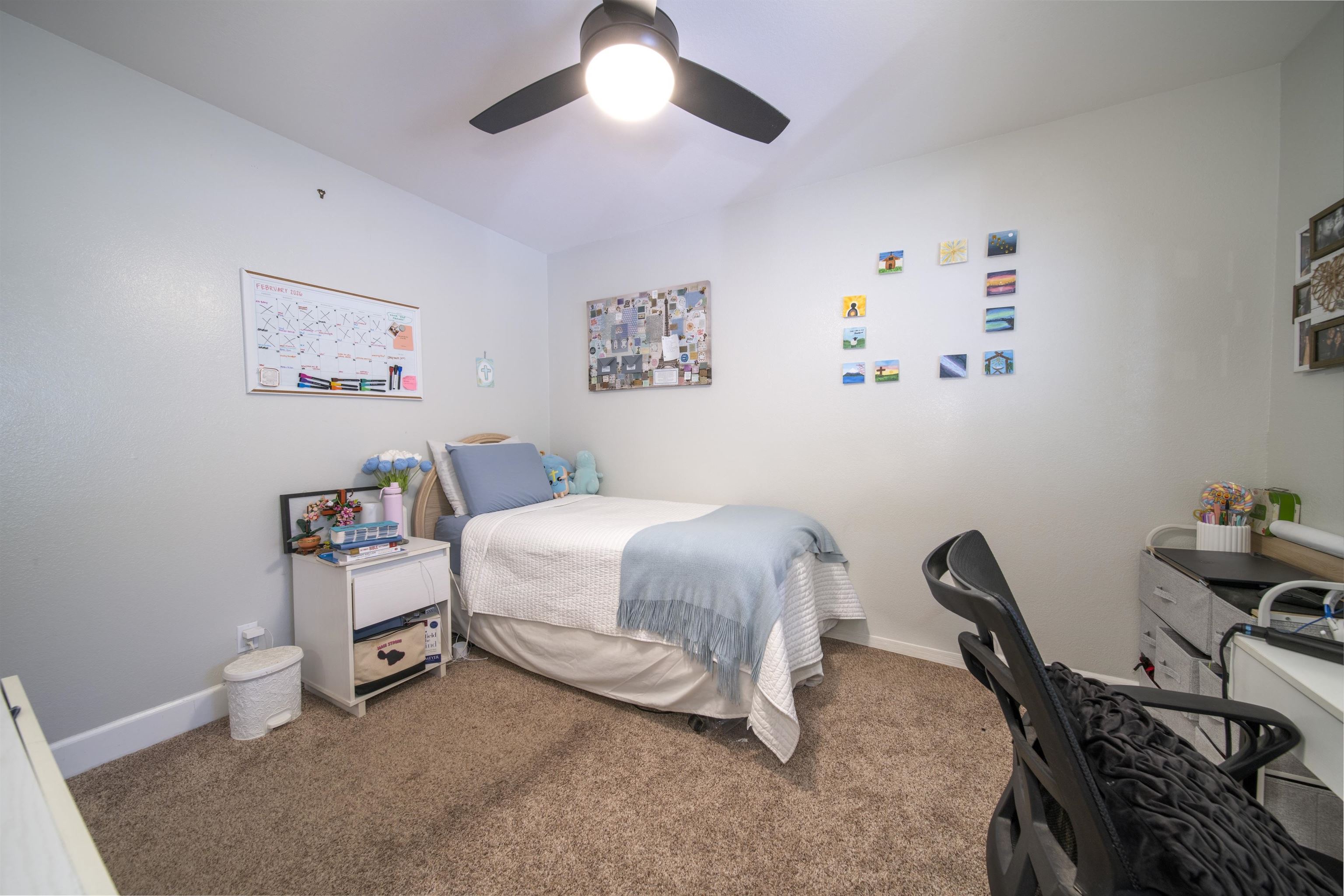 4996 Lower Honoapiilani Road Lahaina, HI 96761 - Photo 31 of 37 a bedroom with a bed a desk and chair