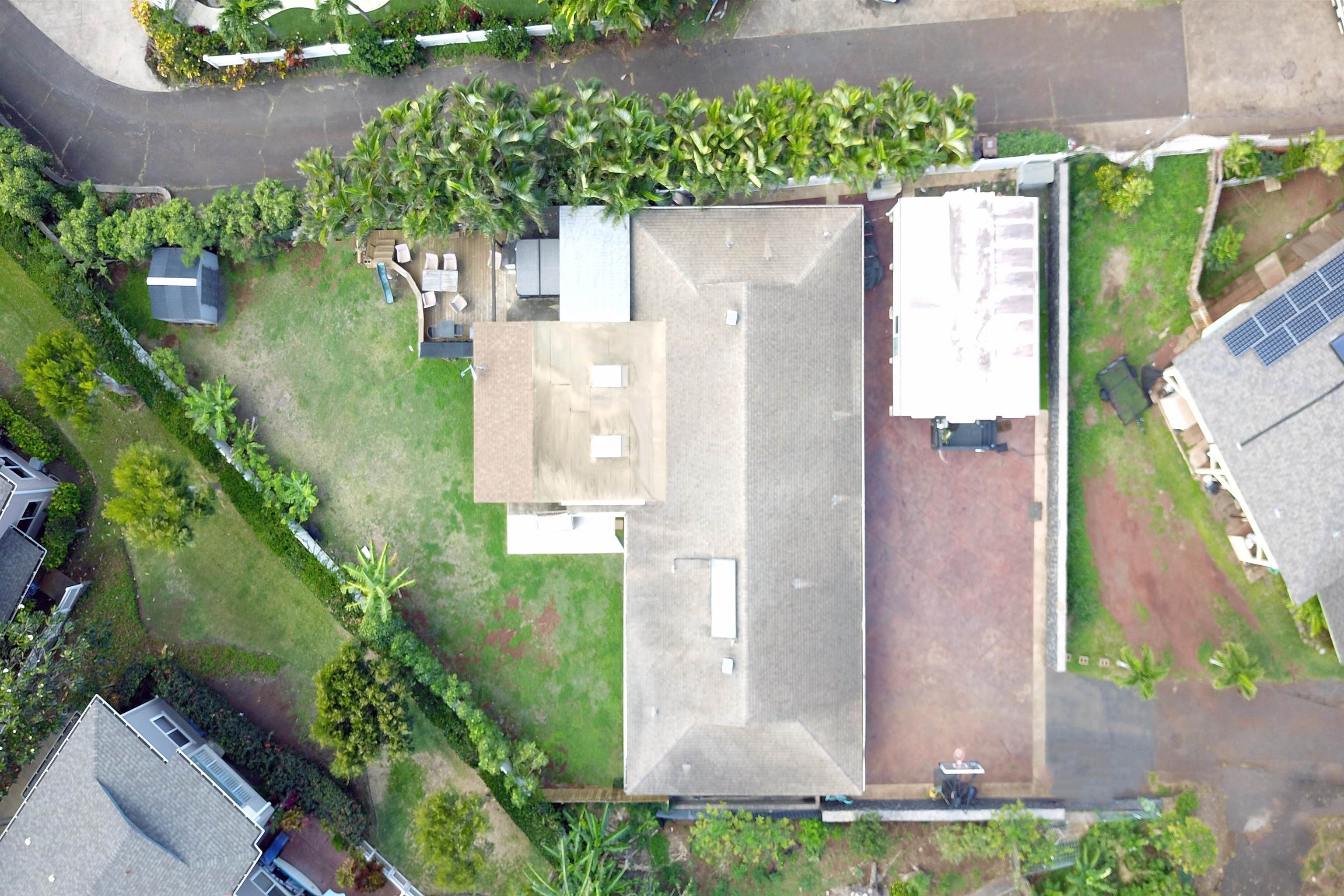 4996 Lower Honoapiilani Road Lahaina, HI 96761 - Photo 37 of 37 an aerial view of a house with a yard and garden