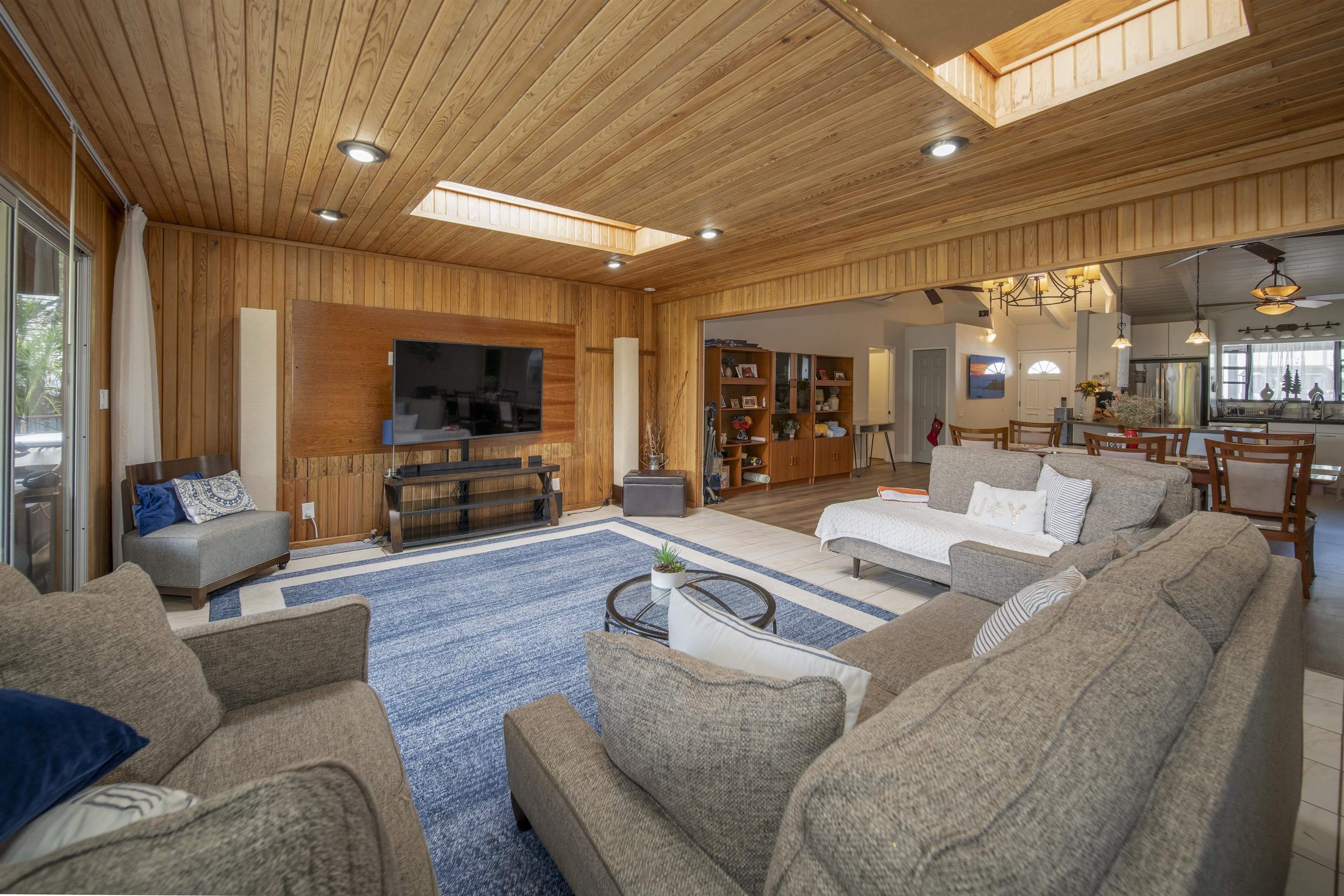 4996 Lower Honoapiilani Road Lahaina, HI 96761 - Photo 7 of 37 a living room with furniture and a flat screen tv