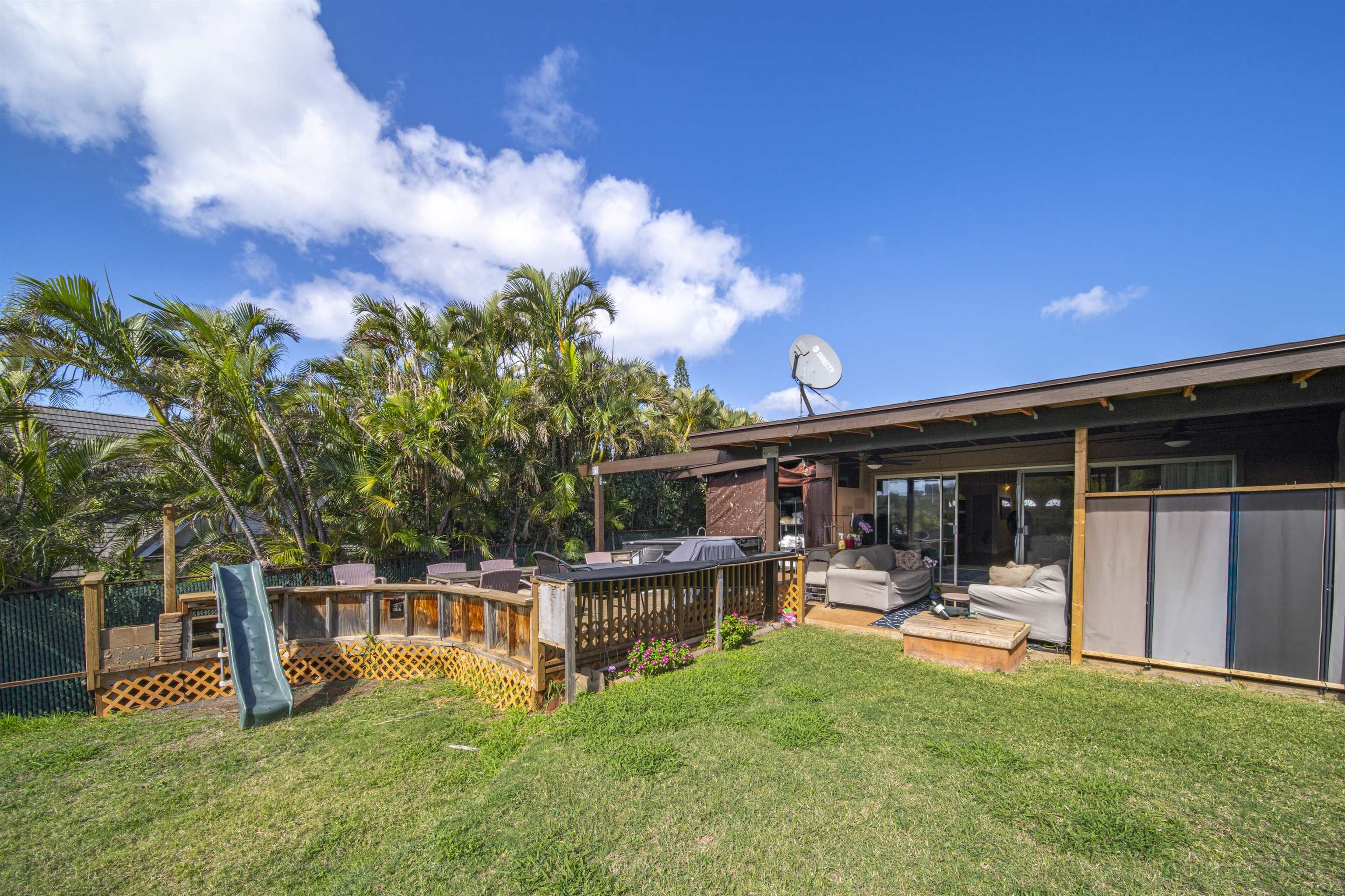 4996 Lower Honoapiilani Road Lahaina, HI 96761 - Photo 9 of 37 a view of a porch with furniture and a yard