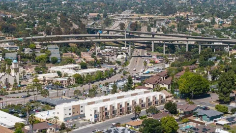 an aerial view of residential house and car parked