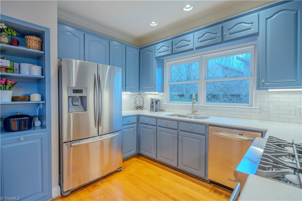 1835 Waterford Pointe Road Lexington, NC 27292 - Photo 13 of 26 Kitchen with hardwood flooring, gas range, refrigerator, microwave, dishwasher