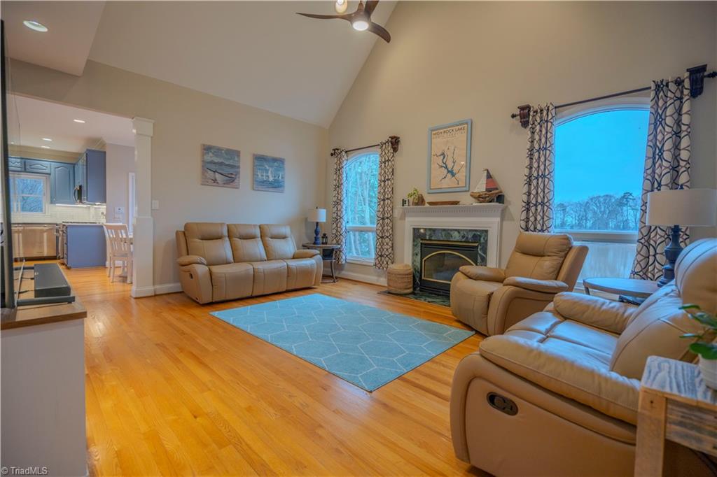 1835 Waterford Pointe Road Lexington, NC 27292 - Photo 8 of 26 Great room open to kitchen, dining and entry with fireplace/gas logs and fantastic view of lake