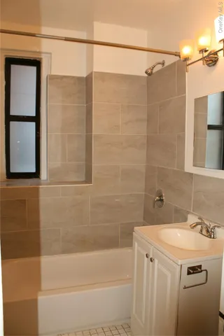 a bathroom with a sink and a shower