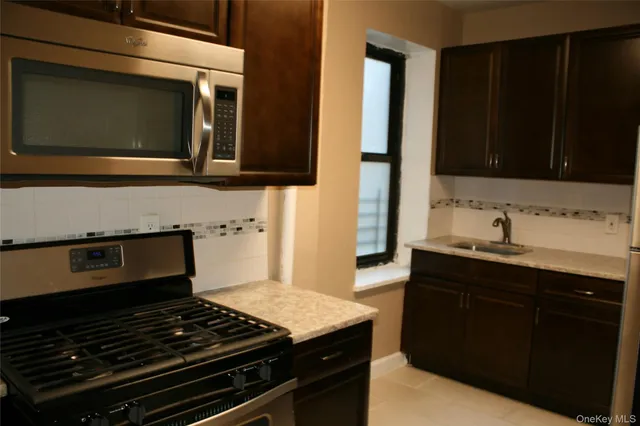 a kitchen with a stove and a microwave