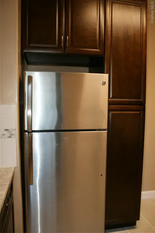 a white refrigerator freezer sitting in a kitchen