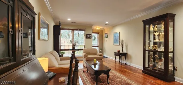 a living room with furniture and large windows