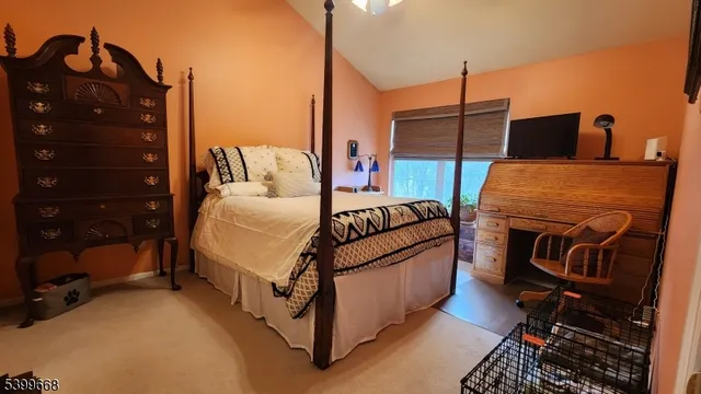 a bed room with a bed window and dresser