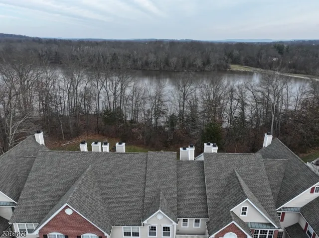 a aerial view of a house with a yard