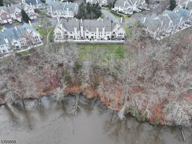 a view of water with a yard