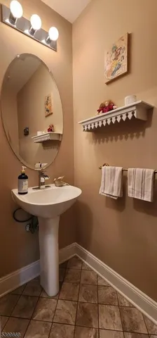 a bathroom with a sink and mirror