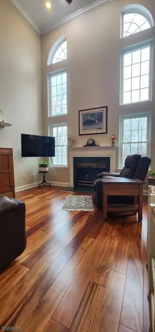 a living room with furniture and a piano