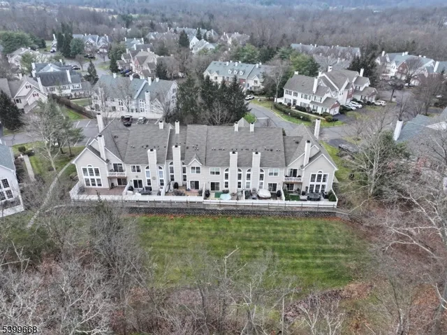 a living room with furniture and a piano
