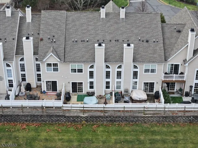 a kitchen with stainless steel appliances granite countertop a refrigerator a stove top oven a sink and dishwasher