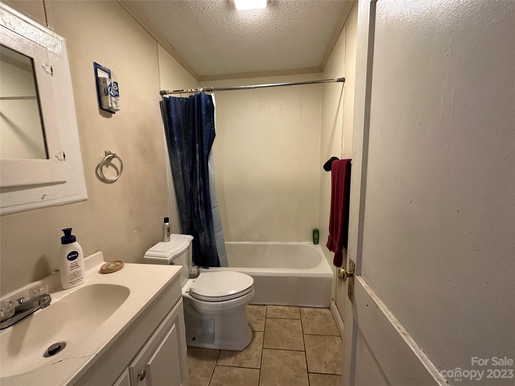 1403 Ln Street Kannapolis, NC 28083 - Photo 18 of 20 a bathroom with a sink toilet and shower