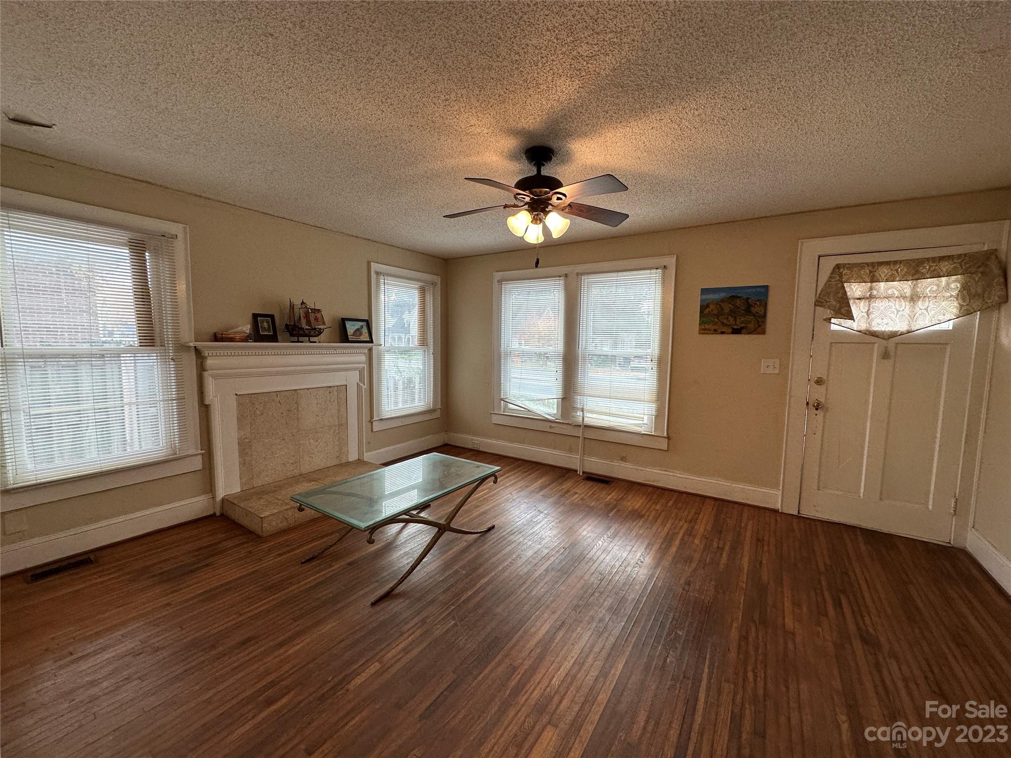 1403 Ln Street Kannapolis, NC 28083 - Photo 6 of 20 a view of livingroom with hardwood floor and a ceiling fan