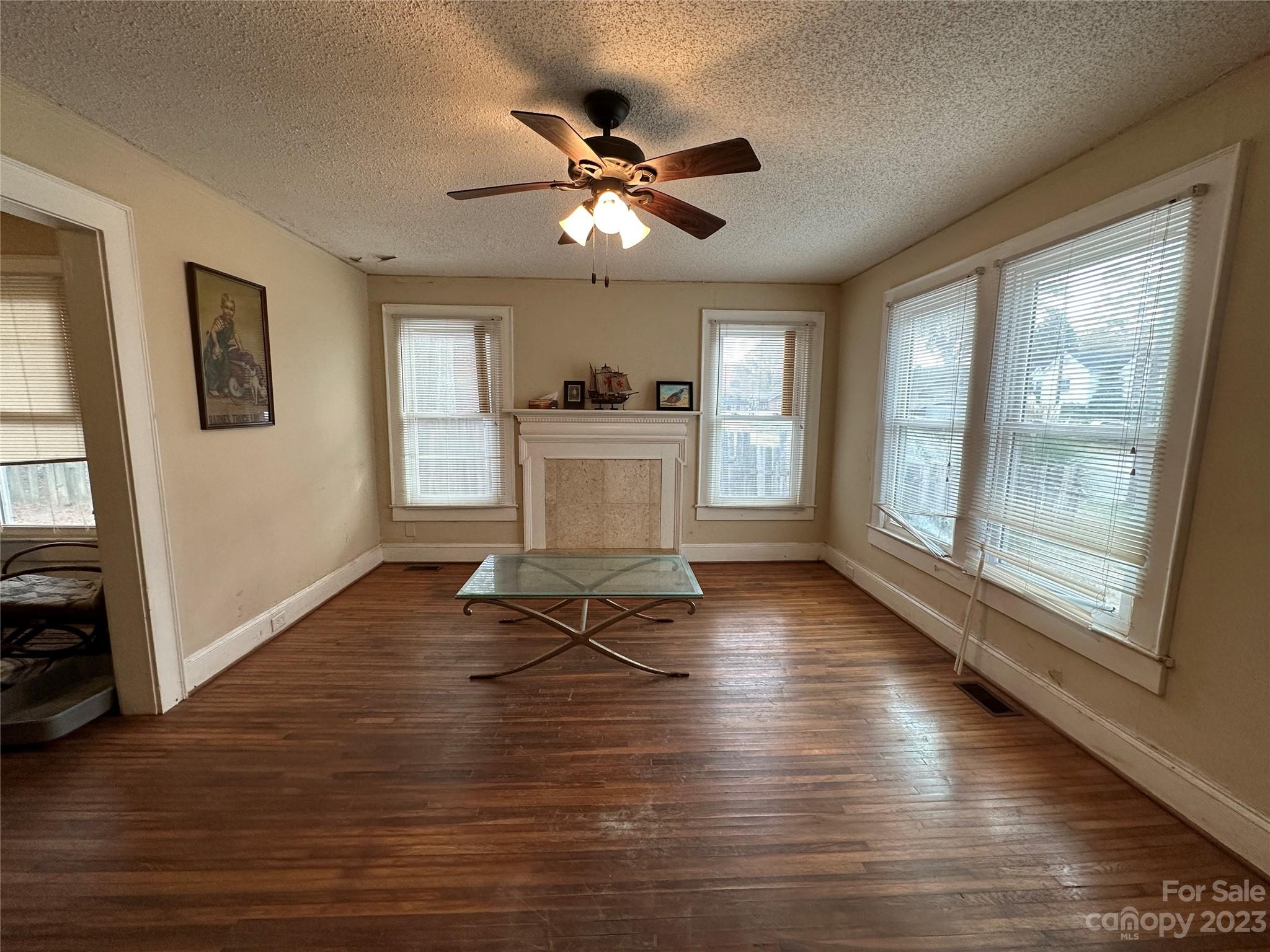 1403 Ln Street Kannapolis, NC 28083 - Photo 7 of 20 a view of livingroom with hardwood floor and a ceiling fan