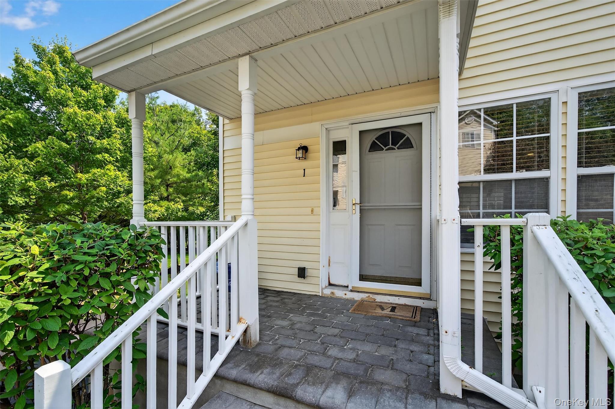 1 Lake Ridge Drive Middletown, NY 10940 - Photo 4 of 44 a view of a house with a porch and furniture