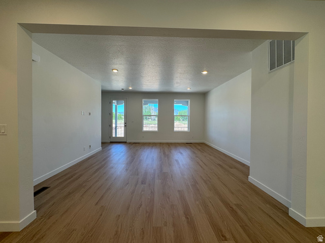 1472 North 1875 West, Unit 151 Layton, UT 84041 - Photo 8 of 20 Spacious interior with wood-finish flooring, recessed lighting, and white baseboards