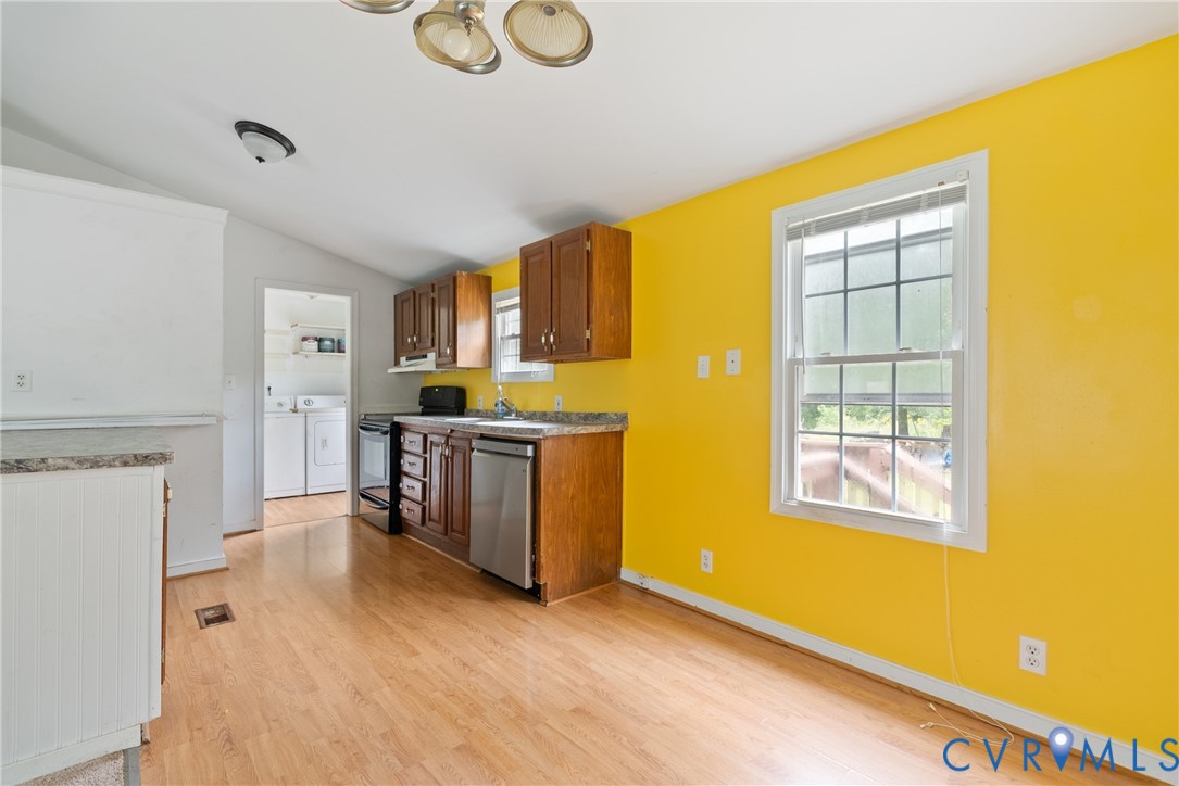 Kitchen featuring separate washer and dryer, light