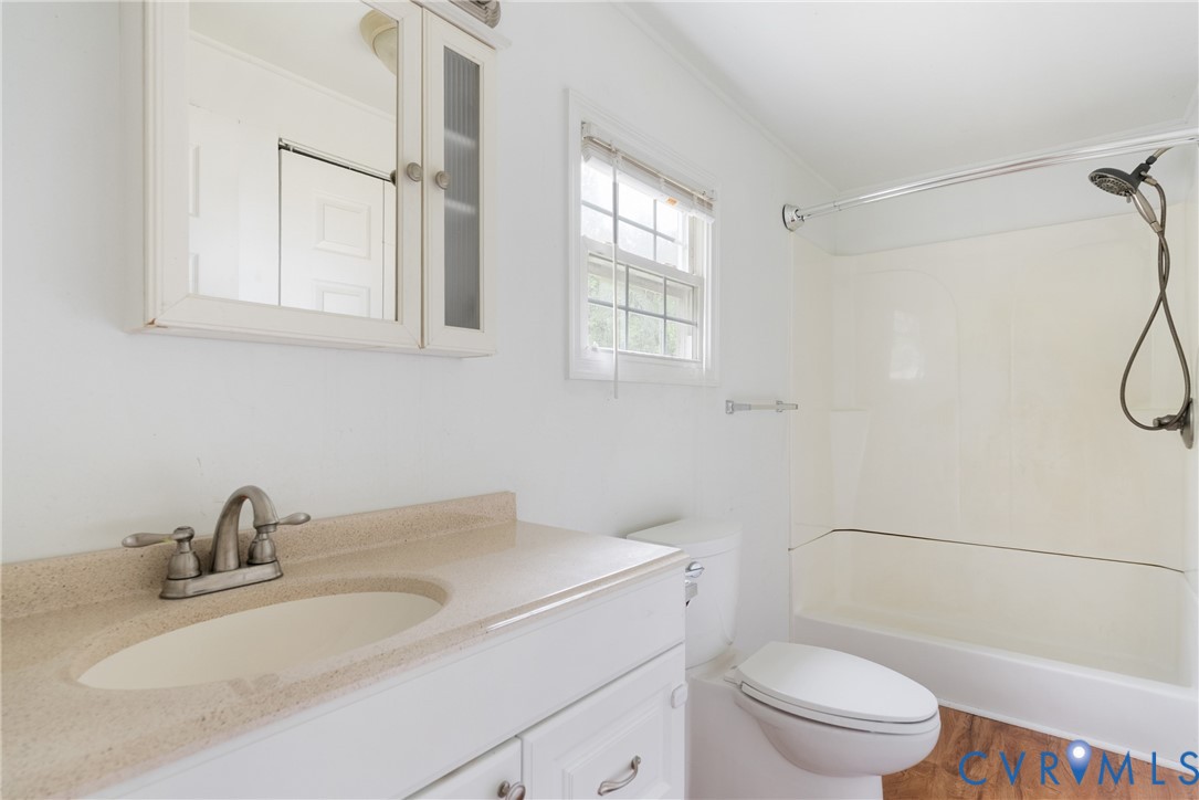 20786 Beaver Dam Road Beaverdam, VA 23015 - Photo 9 of 23 Bathroom featuring vanity, shower / washtub combin
