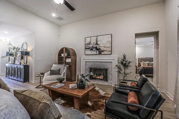 a living room with furniture and a fireplace