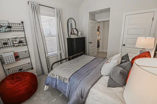 a bedroom with a bed and a closet
