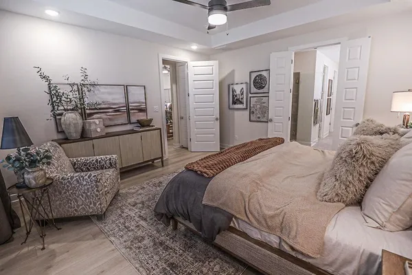 a bedroom with a bed and couch