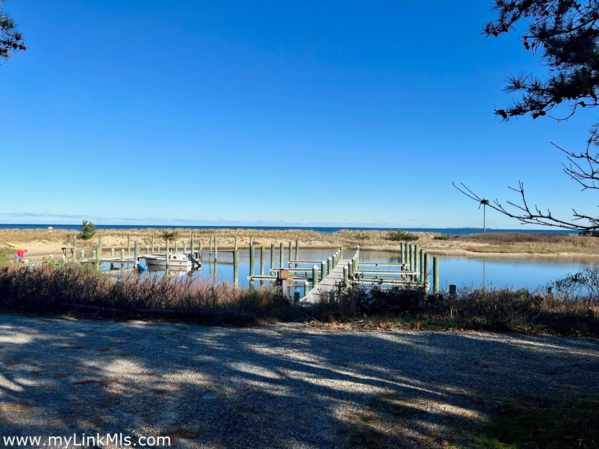 53 Harthaven Road Oak Bluffs, MA 02557 - Photo 6 of 9 a view of a lake with houses in the back
