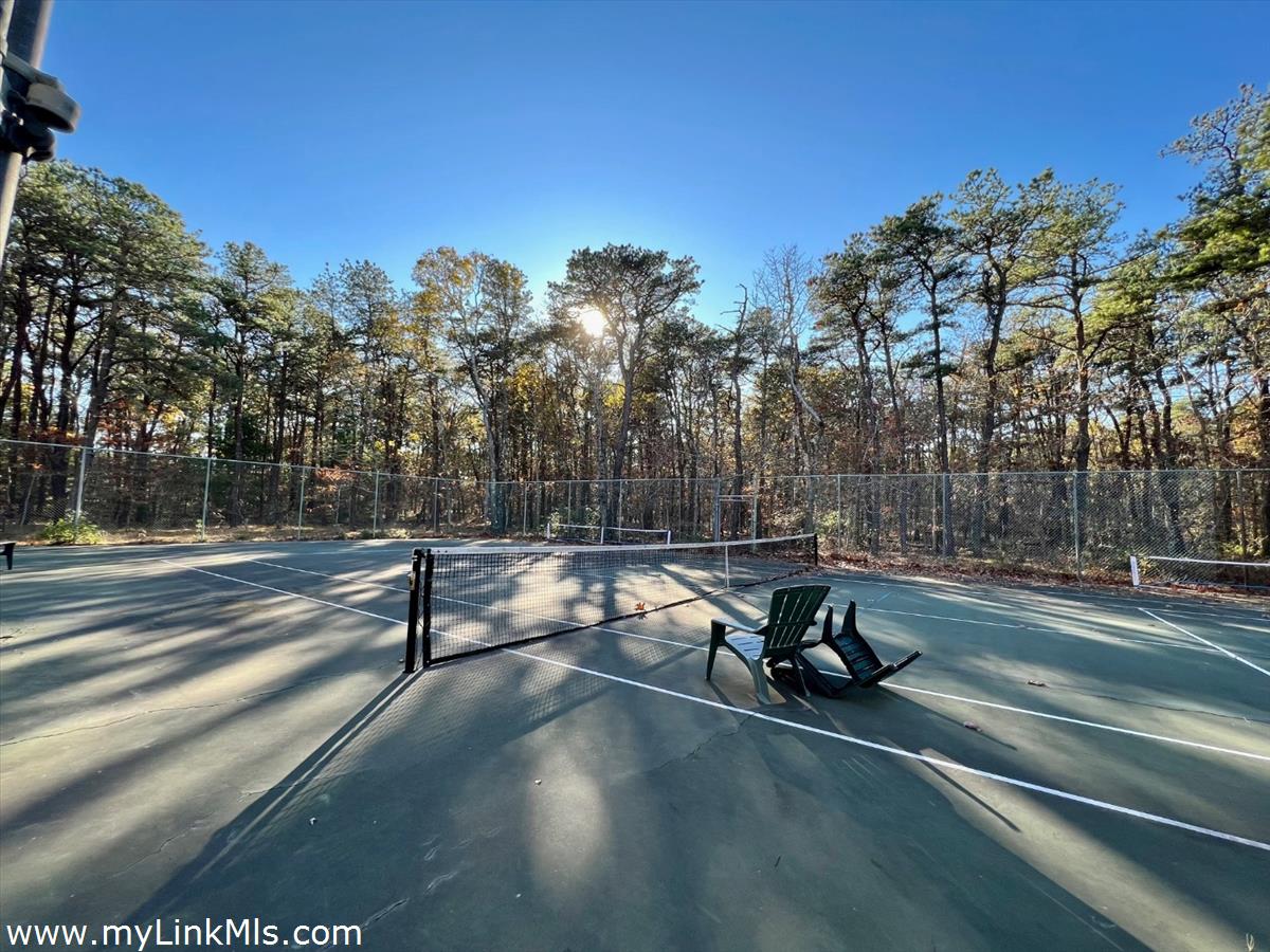 53 Harthaven Road Oak Bluffs, MA 02557 - Photo 8 of 9 a park view with bench and trees