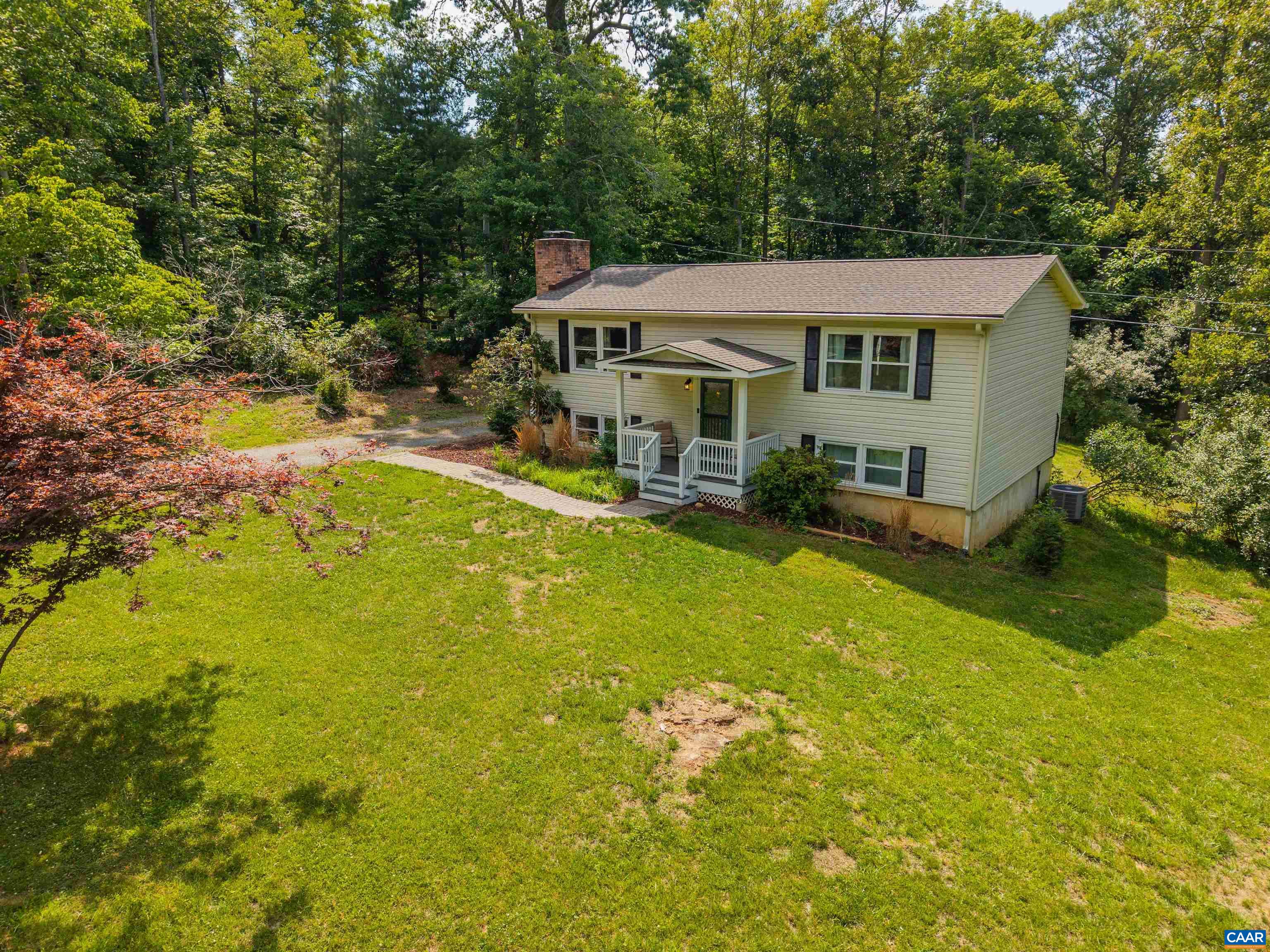 2550 Proffit Road Charlottesville, VA 22911 - Photo 30 of 41 a aerial view of a house with swimming pool and large trees