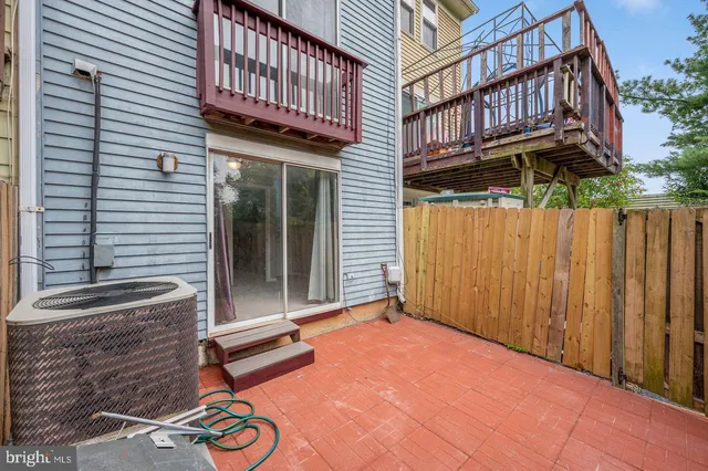 a view of a patio with a table and chairs